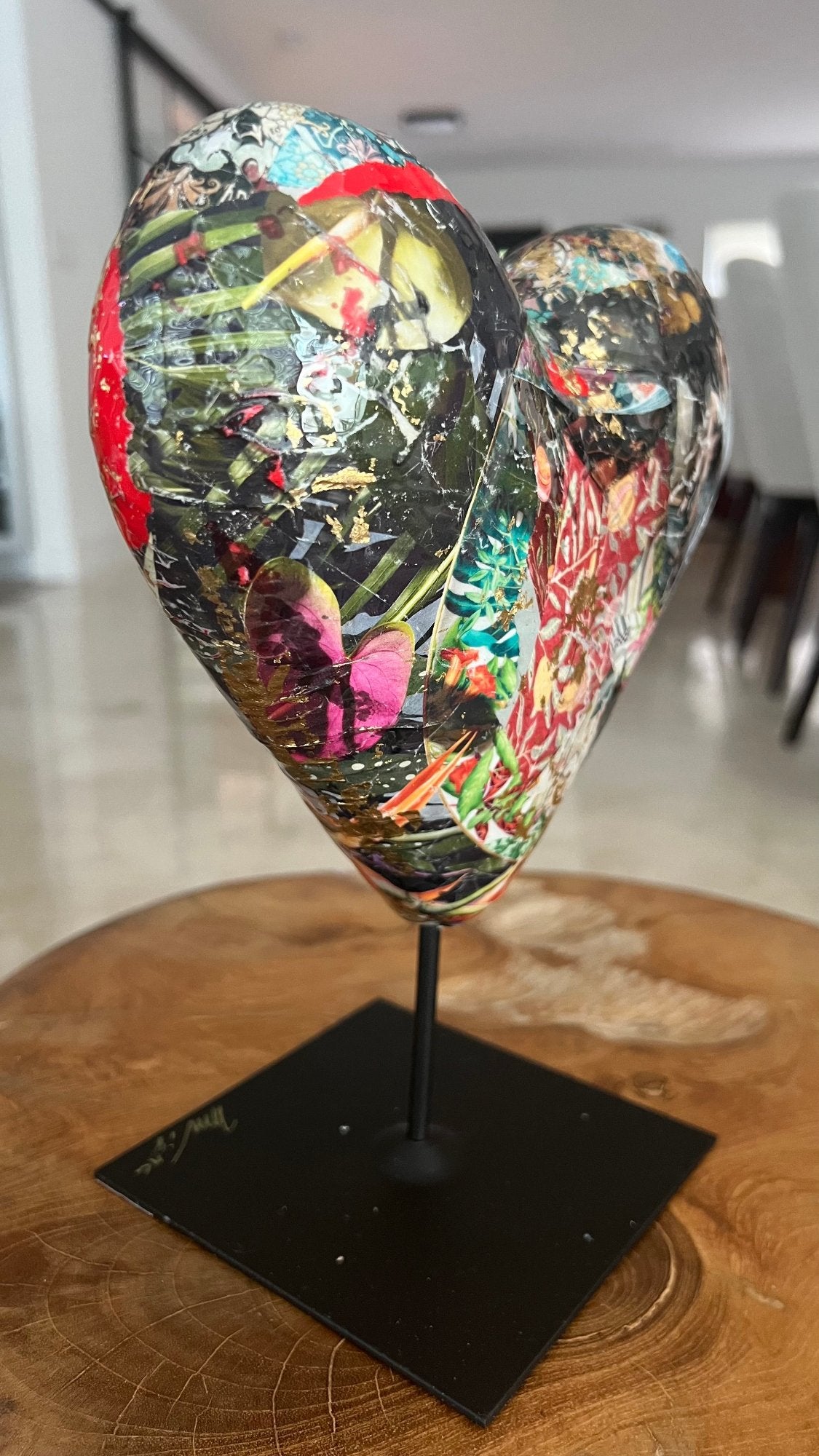 Contemporary heart sculpture showcasing vibrant colors, collage art, and modern textures